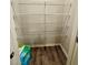 Pantry with several shelves and wood-look flooring at 776 Woodstock Grove Dr, Woodstock, GA 30188