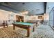 Billiards room featuring pool tables, comfortable seating, and modern lighting fixtures at 1280 W Peachtree Nw St # 3514, Atlanta, GA 30309