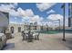 Outdoor recreation area with tables, grilling station, and a fenced-in tennis and basketball court at 1280 W Peachtree Nw St # 3514, Atlanta, GA 30309