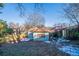Backyard view, revealing a green lawn, wood fence, and the home's exterior at 1453 Graham Sw St, Atlanta, GA 30310