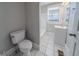Bathroom with tub and shower combination, white vanity, and bright, natural light at 1453 Graham Sw St, Atlanta, GA 30310