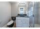Modern bathroom features black granite vanity top and tiled shower at 1453 Graham Sw St, Atlanta, GA 30310