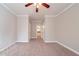 Neutral bedroom features ceiling fan, neutral walls, and carpeted flooring at 1453 Graham Sw St, Atlanta, GA 30310