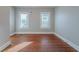 Sun-filled bedroom with hardwood floors, white trim, and fresh, neutral paint at 1453 Graham Sw St, Atlanta, GA 30310