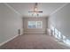 Spacious bedroom features neutral decor, carpet floors, and a ceiling fan at 1453 Graham Sw St, Atlanta, GA 30310