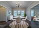Bright dining area with modern chandelier, round table, and views to the living room at 1453 Graham Sw St, Atlanta, GA 30310