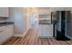 Bright kitchen with stainless appliances and laminate flooring, leading to a hallway at 1453 Graham Sw St, Atlanta, GA 30310