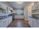 Spacious kitchen featuring stainless steel appliances, granite countertops, and laminate flooring at 1453 Graham Sw St, Atlanta, GA 30310