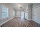 Living room with white fireplace, ceiling fan, and vinyl plank flooring at 1453 Graham Sw St, Atlanta, GA 30310