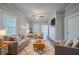 Comfortable living room with neutral tones, plush seating, and a fireplace at 1453 Graham Sw St, Atlanta, GA 30310