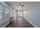 Bright sun room featuring lots of windows, luxury vinyl plank flooring, and a ceiling fan at 1453 Graham Sw St, Atlanta, GA 30310