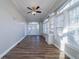 Inviting sun room featuring lots of windows, luxury vinyl plank flooring and ceiling fan at 1453 Graham Sw St, Atlanta, GA 30310