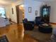Comfortable living room featuring hardwood floors and black arm chairs at 1723 Fort Valley Sw Dr, Atlanta, GA 30311