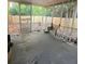 Enclosed back patio featuring a concrete floor, white metal railings, and a view of the fenced backyard at 1723 Fort Valley Sw Dr, Atlanta, GA 30311