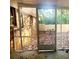 Back patio with screen and fence view providing a cozy spot to relax outdoors at 1723 Fort Valley Sw Dr, Atlanta, GA 30311