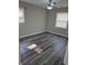 This bedroom features natural light and stylish gray wood flooring at 3975 Northstrand Dr, Decatur, GA 30035