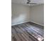 This bedroom features modern ceiling fan and stylish gray wood flooring at 3975 Northstrand Dr, Decatur, GA 30035