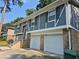 Split-level home boasts a two-car garage and brick facade, providing both convenience and classic curb appeal at 3975 Northstrand Dr, Decatur, GA 30035