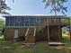 Back of home with wood deck, exterior staircase, and brick siding at 3975 Northstrand Dr, Decatur, GA 30035