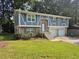 Attractive split-level home showcases fresh exterior paint, a well-manicured lawn, and a convenient two-car garage at 3975 Northstrand Dr, Decatur, GA 30035