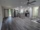 Open-concept kitchen and living area with new flooring, stainless appliances, and modern gray cabinets at 3975 Northstrand Dr, Decatur, GA 30035