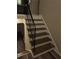 White and brown staircase with metal handrail at 3975 Northstrand Dr, Decatur, GA 30035