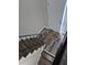 View of the stairway with hardwood flooring and welcome mat at the front door at 3975 Northstrand Dr, Decatur, GA 30035