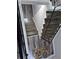 Stairway landing featuring hardwood flooring and stylish metal railing at 3975 Northstrand Dr, Decatur, GA 30035