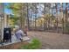 Backyard featuring a patio, grill, bench, and a wooded lot at 426 Mulberry Se Row, Atlanta, GA 30354