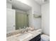 Bathroom featuring granite counters, vanity, sink, mirror, and shower with curtain at 426 Mulberry Se Row, Atlanta, GA 30354