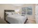 Bedroom featuring a large window with plenty of natural light, neutral decor, and carpet at 426 Mulberry Se Row, Atlanta, GA 30354