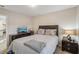 Bedroom with bed, nightstand, dresser, television, and neutral decor at 426 Mulberry Se Row, Atlanta, GA 30354