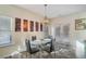 Dining room with modern light fixture and a glass table at 426 Mulberry Se Row, Atlanta, GA 30354