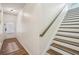 Hallway with hardwood floors and staircase with wooden railing at 426 Mulberry Se Row, Atlanta, GA 30354