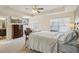 Bright main bedroom with tray ceilings, a large bed, and dresser at 426 Mulberry Se Row, Atlanta, GA 30354