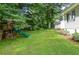 Lush backyard featuring a wooden playset and swing, perfect for outdoor activities and Gathering fun at 4714 Marc Sw Ct, Lilburn, GA 30047