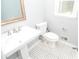 Bathroom with white toilet, sink and black and white tile at 4714 Marc Sw Ct, Lilburn, GA 30047