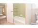 Small, clean bathroom featuring a tub, shower, and toilet at 4714 Marc Sw Ct, Lilburn, GA 30047