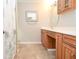 A well-lit bathroom featuring an oval mirror above a double vanity at 4714 Marc Sw Ct, Lilburn, GA 30047