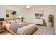 Staged bedroom featuring a bed, framed art and a light color pallette at 4714 Marc Sw Ct, Lilburn, GA 30047