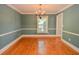 Spacious dining room with hardwood floors and ample natural light offers a versatile entertaining space at 4714 Marc Sw Ct, Lilburn, GA 30047