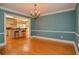Dining room that flows into the kitchen, featuring hardwood floors and plenty of natural light at 4714 Marc Sw Ct, Lilburn, GA 30047