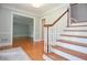 Foyer featuring hardwood stairs and flooring at 4714 Marc Sw Ct, Lilburn, GA 30047