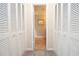 Neutral hallway featuring doors and access to another room at 4714 Marc Sw Ct, Lilburn, GA 30047