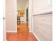 Hallway featuring hardwood floors and built-in storage at 4714 Marc Sw Ct, Lilburn, GA 30047