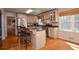 Eat-in kitchen with granite counters, stainless appliances, and hardwood floors provides a modern culinary space at 4714 Marc Sw Ct, Lilburn, GA 30047