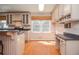 Bright kitchen with hardwood floors, breakfast bar, and natural light offers a functional cooking area at 4714 Marc Sw Ct, Lilburn, GA 30047
