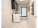 Functional laundry room with washer, dryer, and storage; designed for convenience and efficiency at 4714 Marc Sw Ct, Lilburn, GA 30047