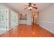 Open living room with hardwood floors, adjacent to a butler's pantry at 4714 Marc Sw Ct, Lilburn, GA 30047