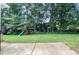 The spacious backyard is complemented by a playset with swing and slide at 4714 Marc Sw Ct, Lilburn, GA 30047